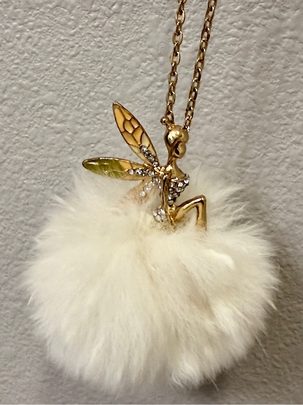 Gold Chain Necklace with Jeweled Fairy Pendant on Cream Fur Pom-Pom